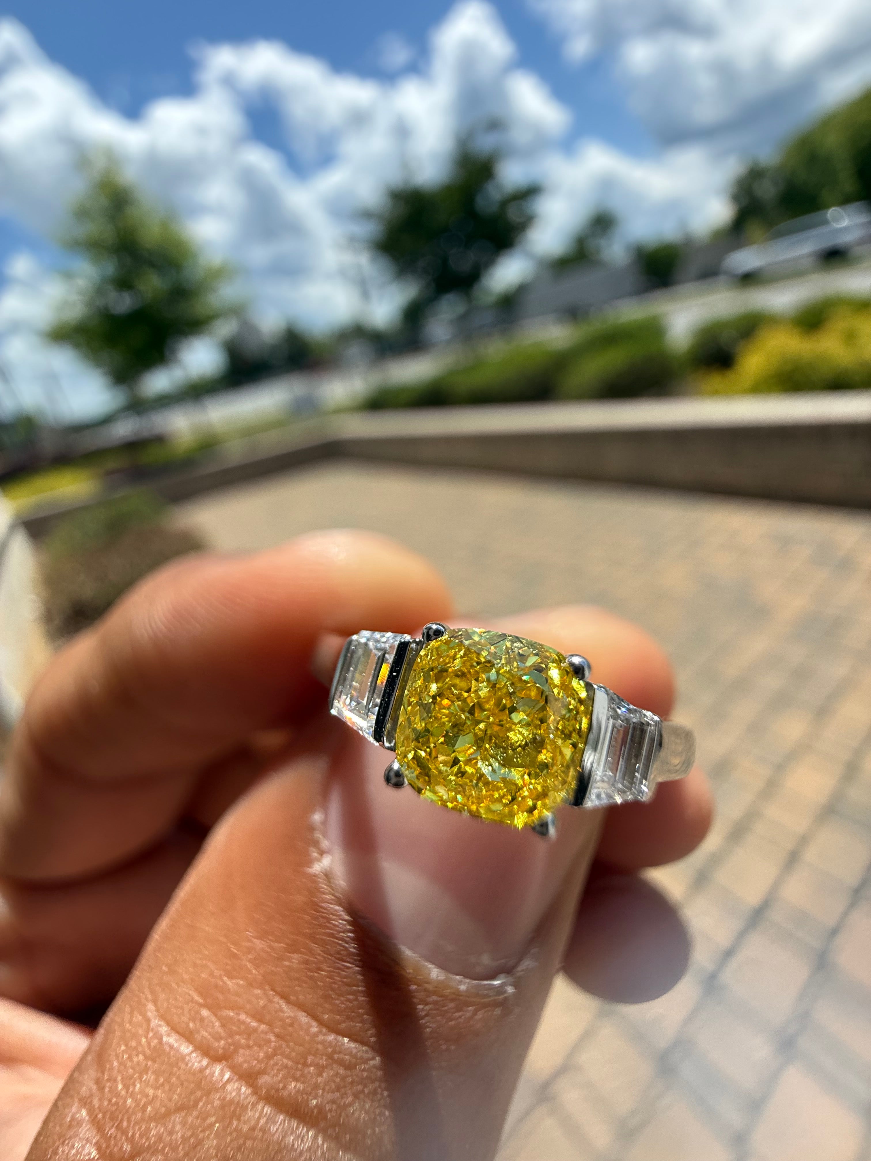 1.5 carat  cushion center stone fancy yellow emerald cut ring in fancy vivid yellow igi certified stone handcrafted in color high cut with  handcrafted ring made with 14k gold in grown diamond igi certified