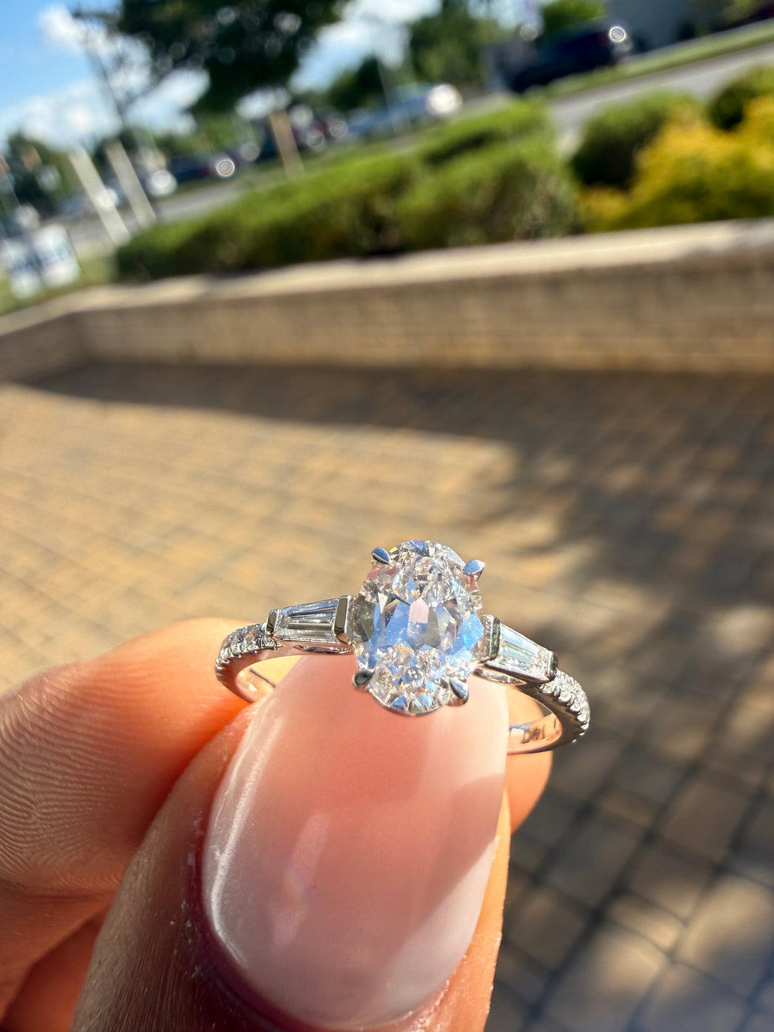 1.5 carat oval cut ring cut E vs IGI certified with special cut baguette on side highly handcrafted in grown diamond 14k gold