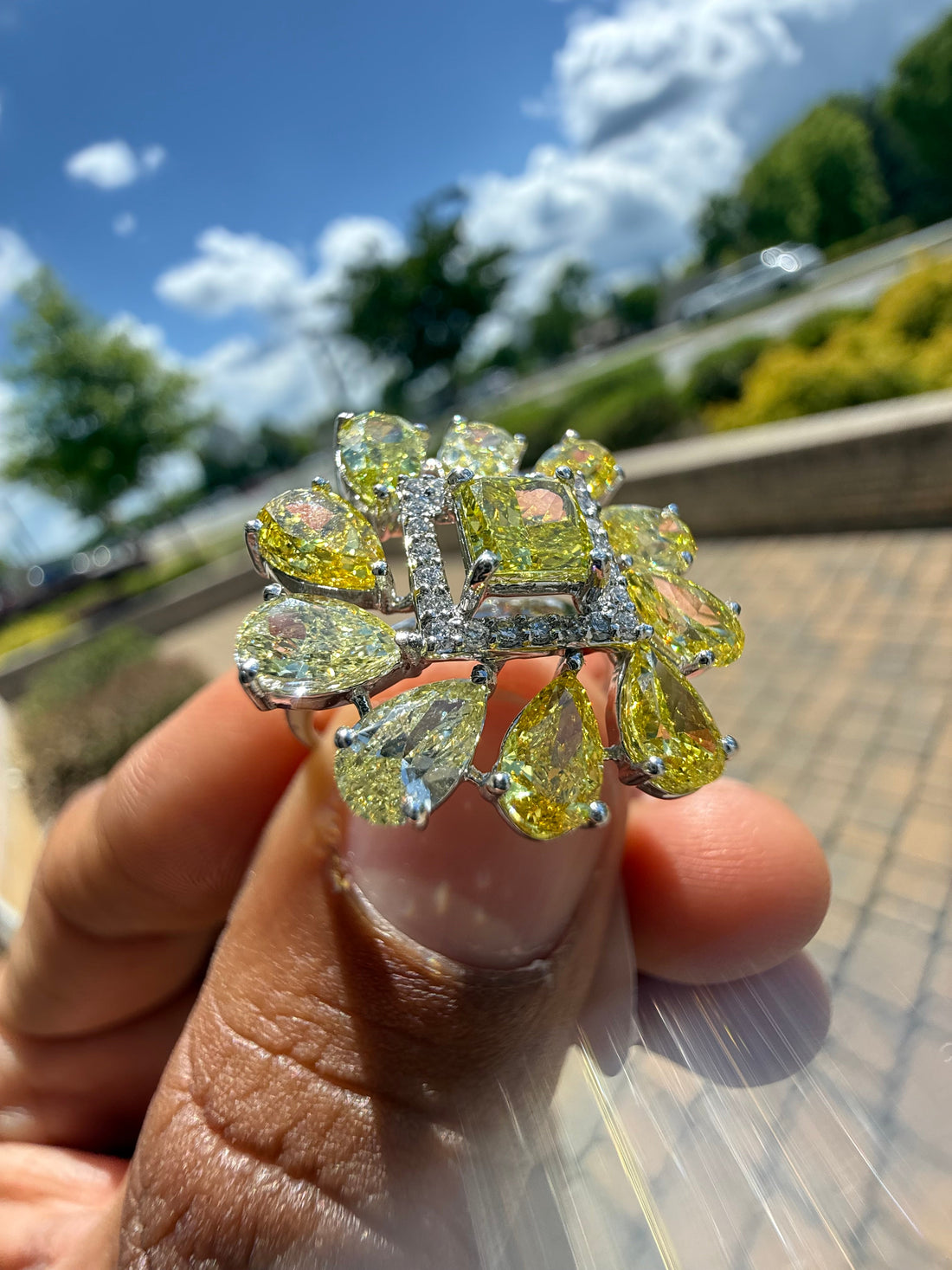 5 carat fancy yellow oval with center princess cut ring in fancy vivid yellow igi certified center stone with special cut side stones on side handcrafted in color high cut with  handcrafted ring made with 14k gold in grown diamond igi certified