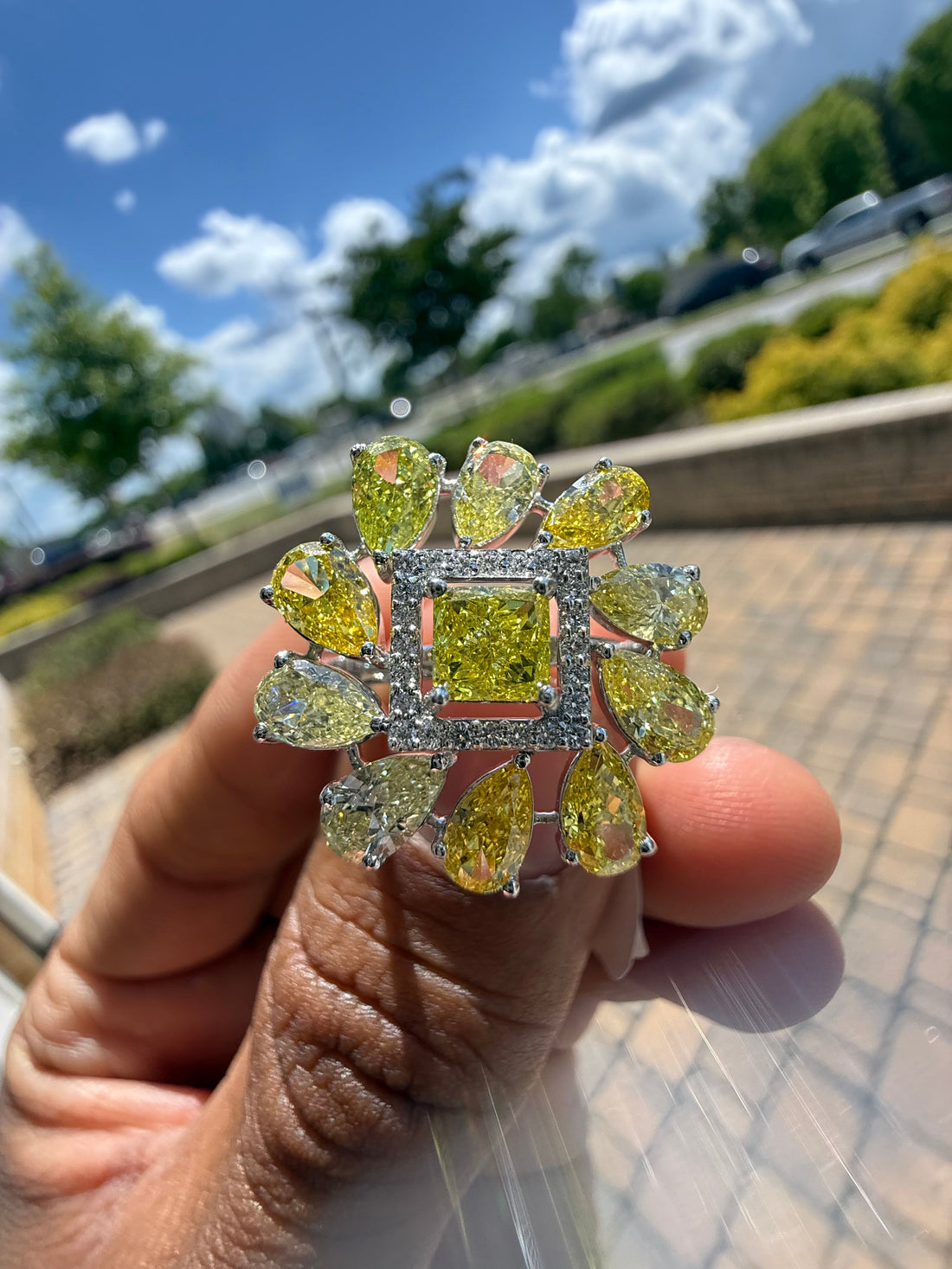 5 carat fancy yellow oval with center princess cut ring in fancy vivid yellow igi certified center stone with special cut side stones on side handcrafted in color high cut with  handcrafted ring made with 14k gold in grown diamond igi certified