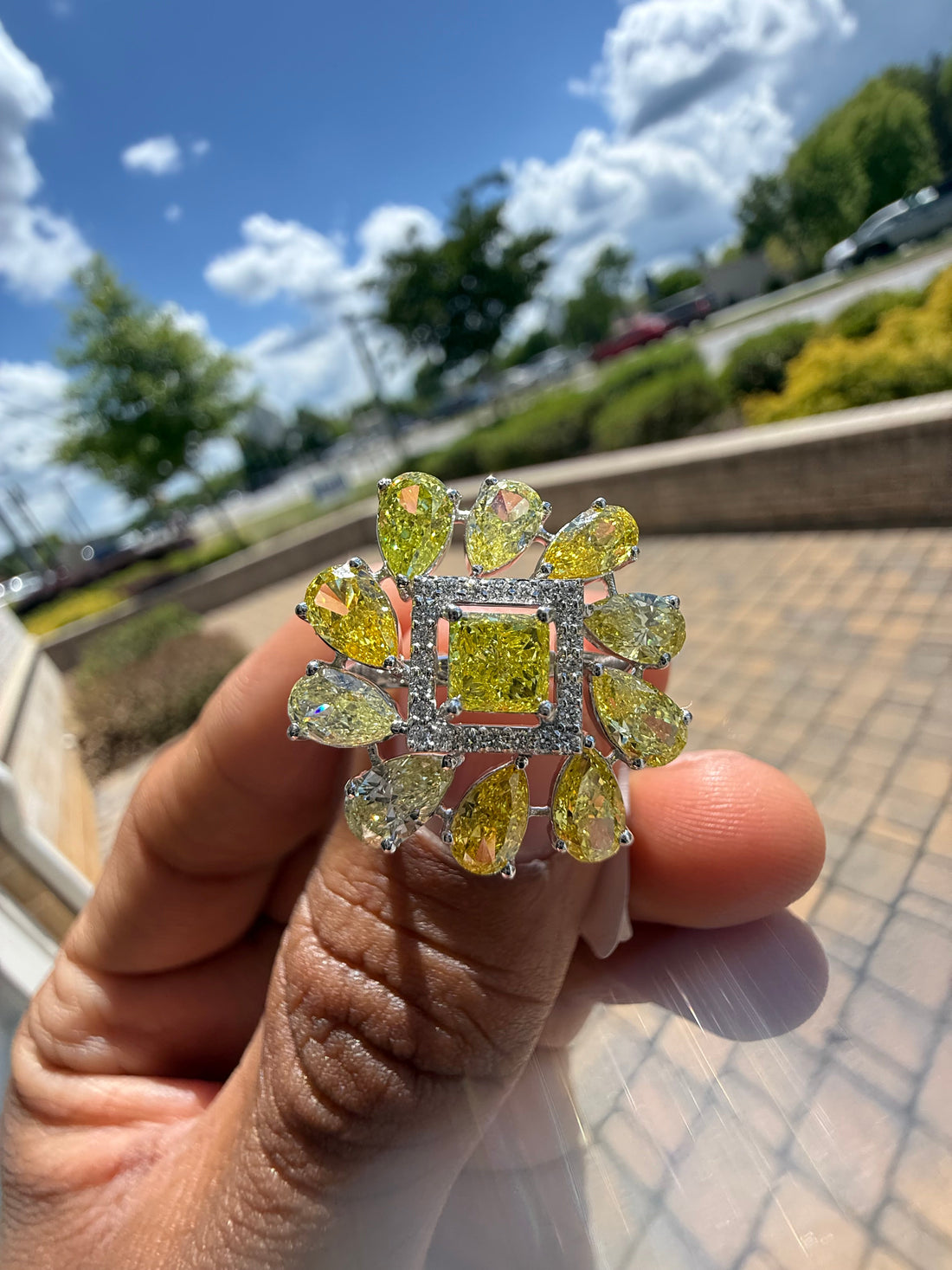 5 carat fancy yellow oval with center princess cut ring in fancy vivid yellow igi certified center stone with special cut side stones on side handcrafted in color high cut with  handcrafted ring made with 14k gold in grown diamond igi certified