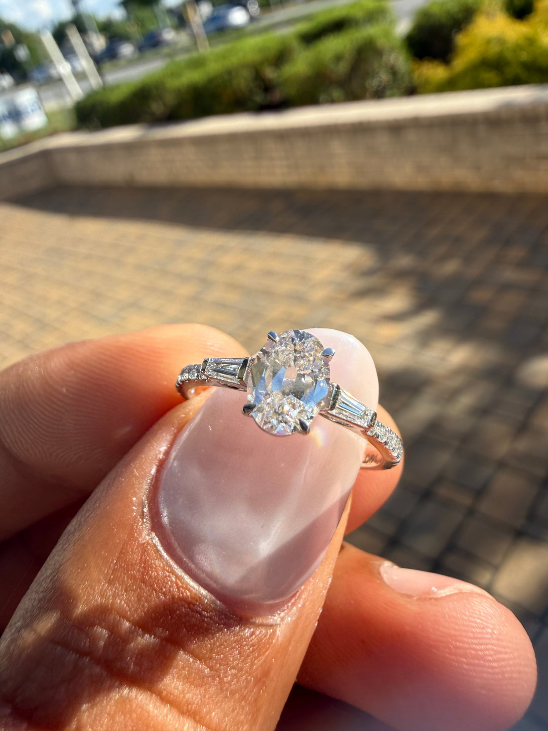 1.5 carat oval cut ring cut E vs IGI certified with special cut baguette on side highly handcrafted in grown diamond 14k gold