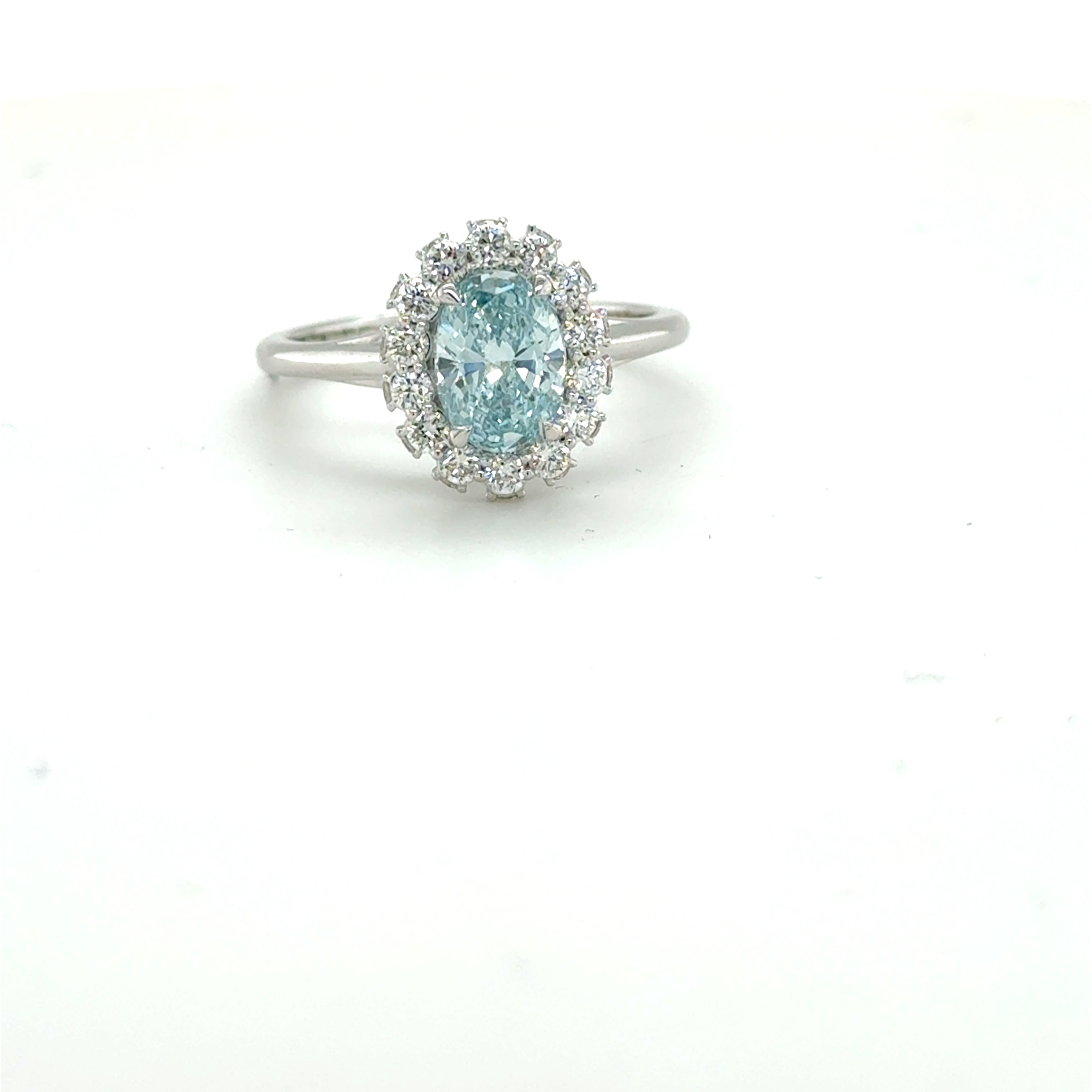 3 carat center fancy blue oval  E vs igi certified with high cut on side made with high craftsmanship with round brilliance ( made in 14k gold)