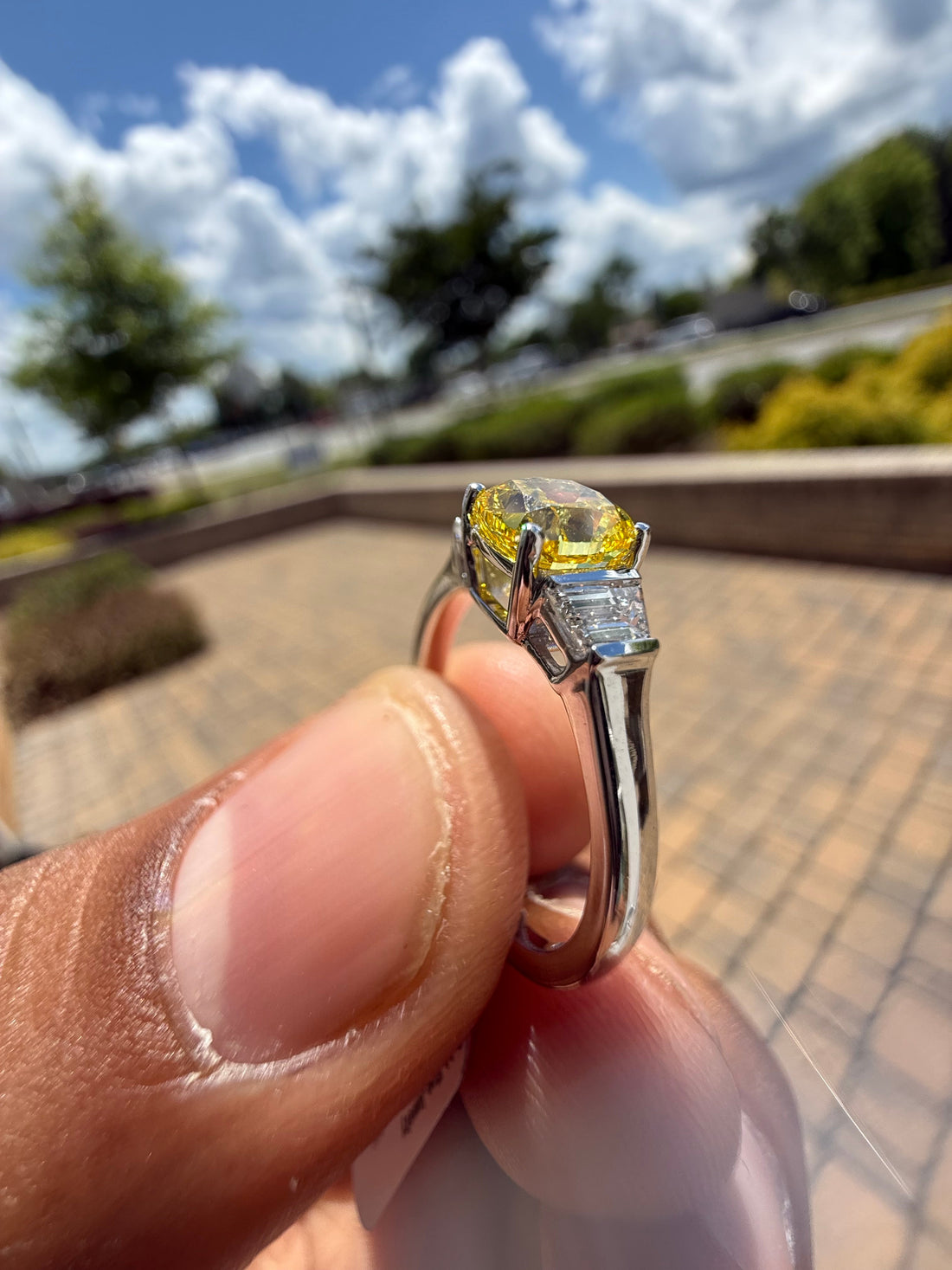 1.5 carat  cushion center stone fancy yellow emerald cut ring in fancy vivid yellow igi certified stone handcrafted in color high cut with  handcrafted ring made with 14k gold in grown diamond igi certified