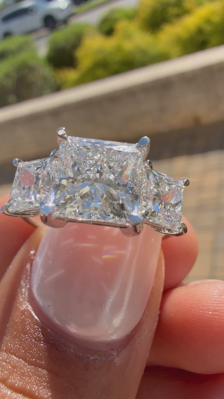 5 carat center princess  Cut with 3 carat center stones E vs igi certified with high cut on side made with high craftsmanship with round brilliance made in 14k gold)