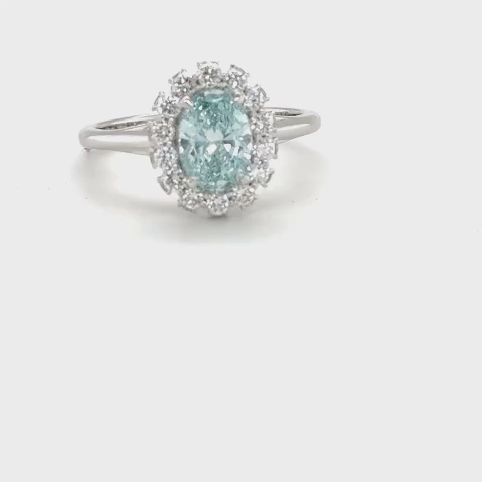 3 carat center fancy blue oval  E vs igi certified with high cut on side made with high craftsmanship with round brilliance ( made in 14k gold)